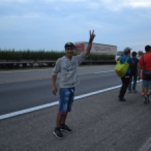 Syrian refugee on his way down the M1 highway toward Austria.