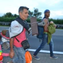 Syrian refugees on their way down the M1 highway toward Austria.